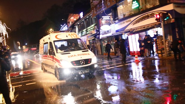 An ambulance rushes from the scene of an attack in Istanbul.