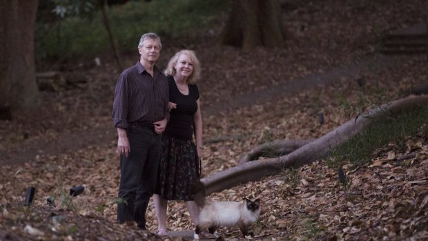 Professor Chris Dickman of Sydney Univeristy and his wife, Carol, stroll with their cat in Woollahra's Cooper Park.
