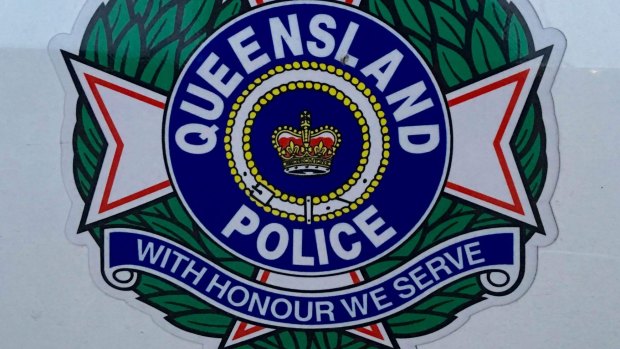 Police are searching for an axe-wielding thief, who fled a Stafford Heights newsagency empty-handed after an employee refused to cooperate on Saturday morning.