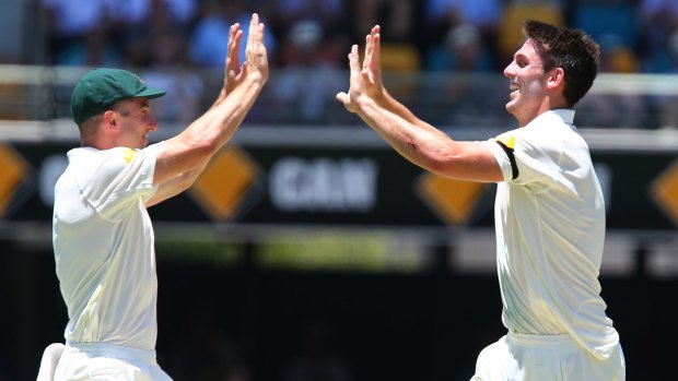 Mitch Marsh celebrates his first Test wicket with brother Shaun.