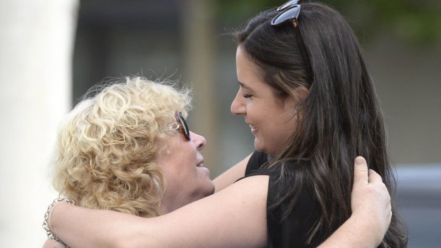 Veronika Taylor, sister of Elvira Buckingham, hugs former Shepparton News reporter Tammy Mills. 