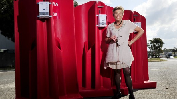 CEO of Canberra CBD limited Jane Easthope with the portable urinals.