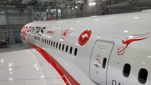 The plane's design features every Qantas logo since its 1920 founding in outback Queensland.