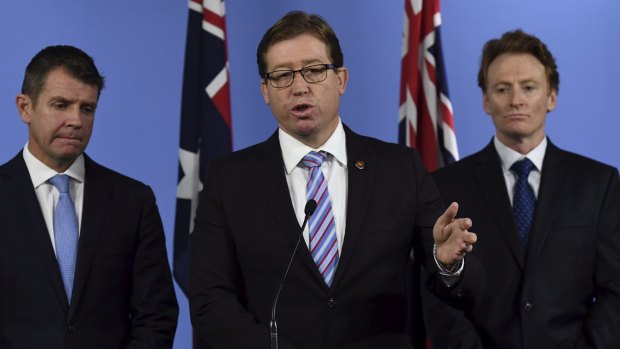 Deputy Premier Troy Grant (centre) during a conference on the report of the Special Commission of Inquiry into the Greyhound Racing Industry. 