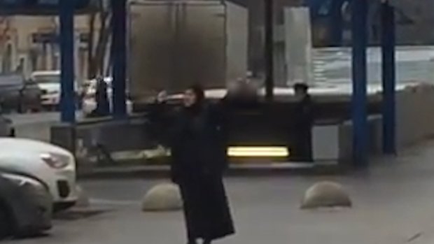 A woman is in custody after allegedly brandishing the head of a child near a metro station in Moscow on Monday.