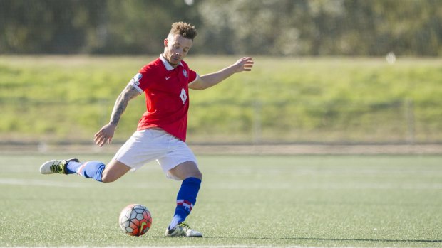Canberra FC's Thomas James kicks the ball.