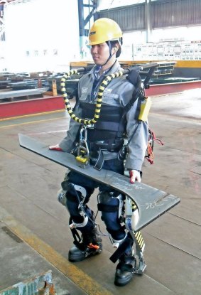 A worker wearing an exoskeleton suit at the Daewoo plant in South Korea