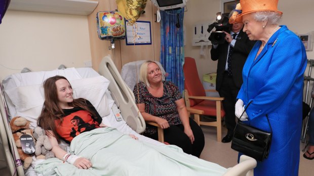 The Queen speaks to Millie Robson, 15, and her mother, Marie, during a visit to the Royal Manchester Children's Hospital.