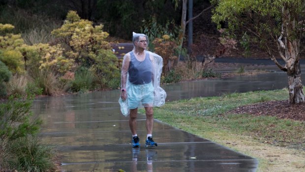 Robert Long goes on his daily walk in Sydney Park, despite the rain earlier this month.