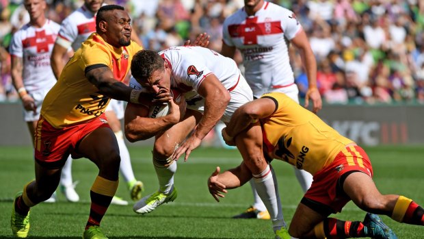 Direct: Sam Burgess makes headway, giving PNG defenders plenty of headaches.