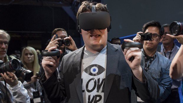 Palmer Luckey, co-founder of Oculus VR and creator of the Oculus Rift, demonstrates the new Oculus Rift headset and Touch controller.