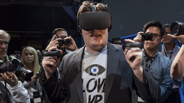 Palmer Luckey, co-founder of Oculus VR and creator of the Oculus Rift, demonstrates the new Oculus Rift headset and Touch controller.