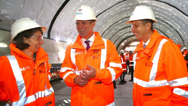 NSW Premier Mike Baird (centre), Treasurer Gladys Berejiklian and Transport and Infrastructure Minister Andrew Constance discuss the Sydney Metro Northwest rail link.