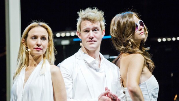 Eddie Perfect with Lisa McCune (as Simone Warne ) and Christine Whelan (as Liz Hurley) in <i>Shane Warne: The Musical</i> in 2013.