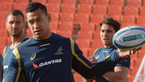 Captain's gun: Israel Folau, flanked by Quade Cooper and Nick Phipps, at the captain's run in Mendoza.