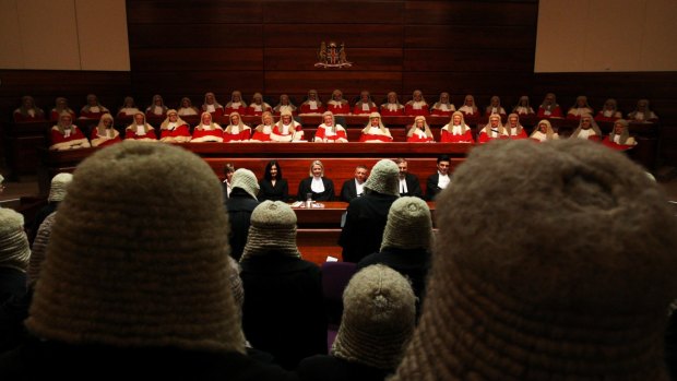 NSW Chief Justice Tom Bathurst, centre, has introduced a procedure requiring judges to write brief reasons for granting a warrant for covert surveillance.
