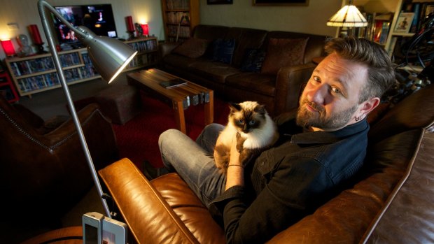 Dr Stephen Fleischfresser and his cat, Max Power, to whom he is hopelessly devoted. 