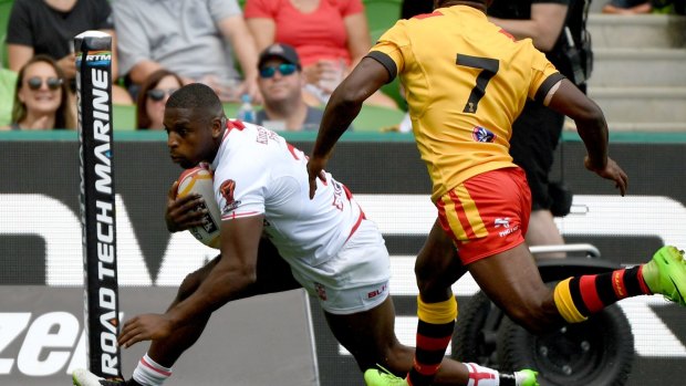 Stroll: Jermaine McGillvary goes over out wide for one of his two tries.
