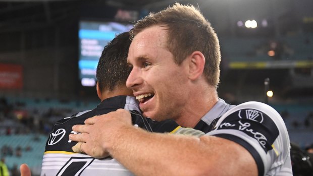 Michael Morgan and Te Maire Martin celebrate after the Cowboys' win.