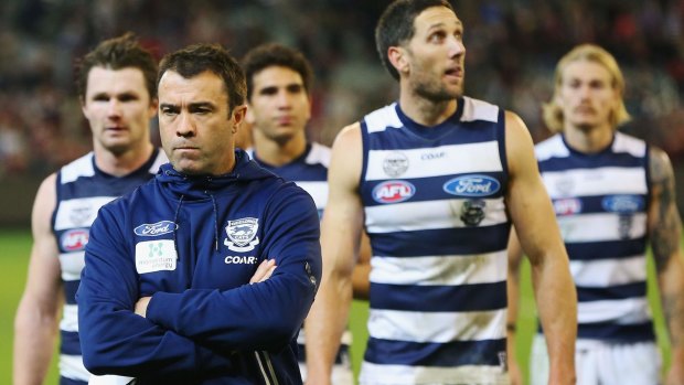 Geelong Chris Scott leads the Cats off the MCG after their loss to Essendon last week.