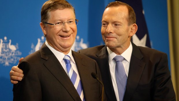 Prime MInister Tony Abbott with now former Victorian premier Denis Napthine in October. A campaign by Victorian unions, which helped Labor win the state election, will be replicated to unseat Mr Abbott. 
