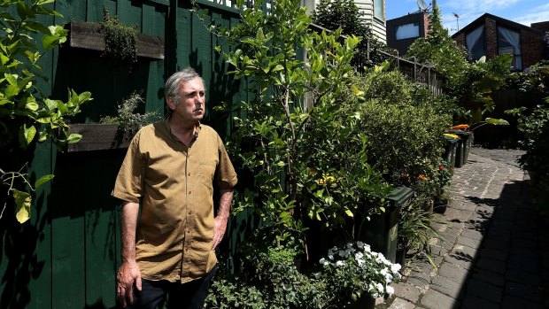 Greens councillor Sam Gaylard photographed in the controversial laneway garden.