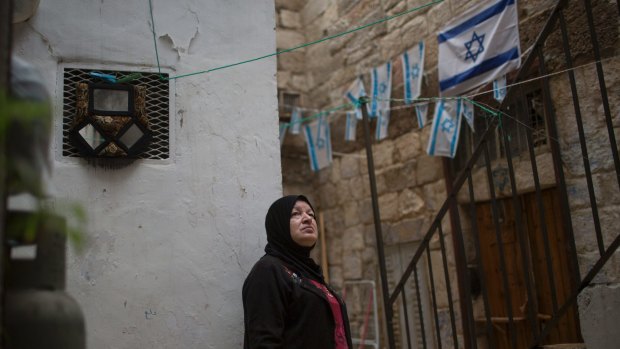 Nawal Eid Hashimeh, a Palestinian woman whose family received eviction orders, outside her house in the Old City in East Jerusalem.