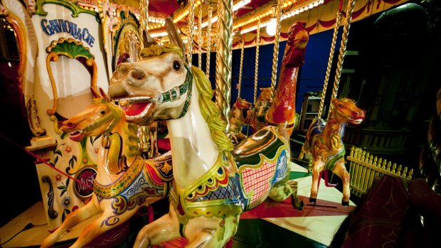 Rider: A 100-year-old carousel is on display at Circus Factory.