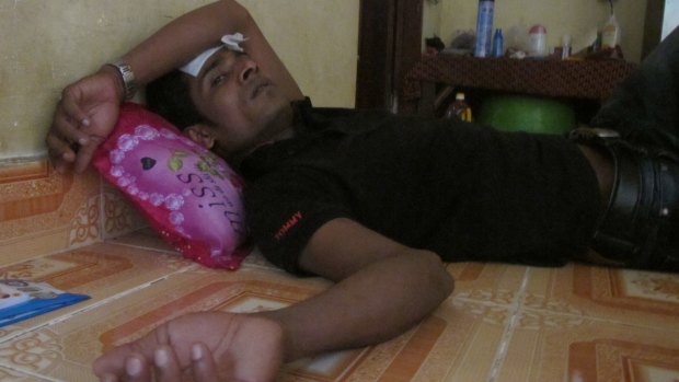 Mohammed Rashid, a refugee from Nauru, lies unwell in a house in a Phnom Penh suburb.