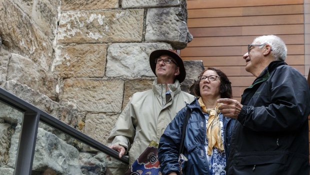 Tour guide Rex Wood shows French tourists Sydney and Monique Birchall around the Mint. The building is Sydney's oldest surviving public building. 