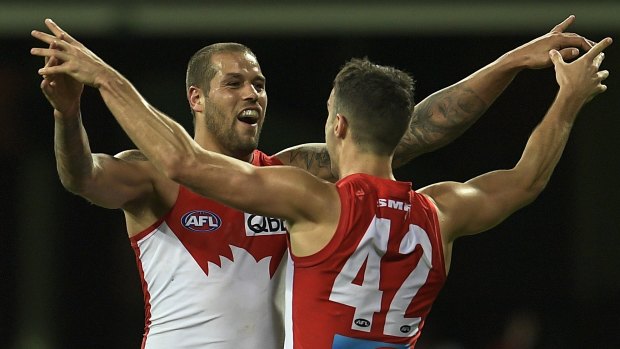 Another win: Lance Franklin celebrates kicking a goal with Xavier Richards during the Swans-Richmond match on Saturday.