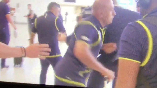 The South African security guard elbowing the journalist in the ribs.