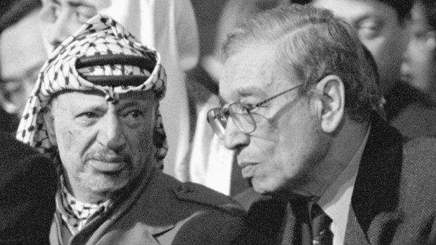 In this January 11, 1996 photo, Palestinian leader Yasser Arafat, left, and UN Secretary General Boutros Boutros-Ghali attend the funeral mass of former French president Francois Mitterrand in Paris