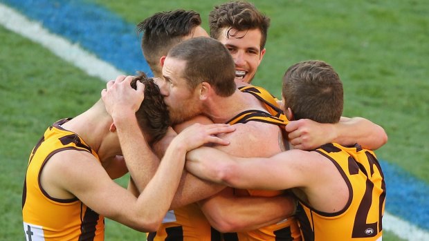 Jarryd Roughead (centre) is among the big-name Hawks named for the clash against Collingwood.