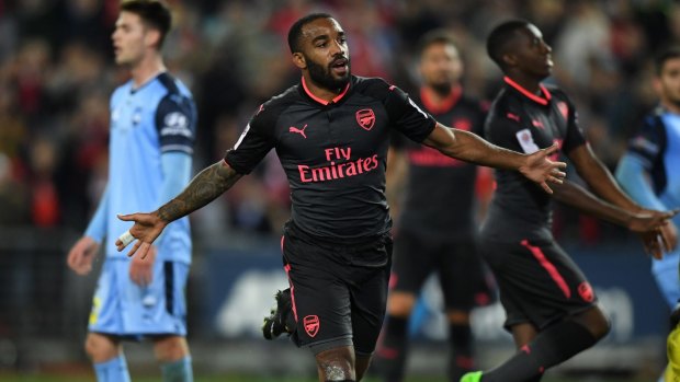 Gun debut: Alexandre Lacazette celebrates his first goal in an Arsenal jersey, against Sydney FC at ANZ Stadium on Thursday night.