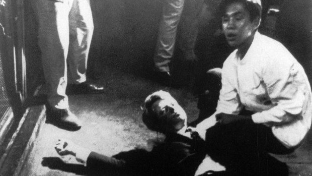 Senator Robert F. Kennedy awaits medical assistance after being shot at the Ambassador hotel in Los Angeles in 1968.