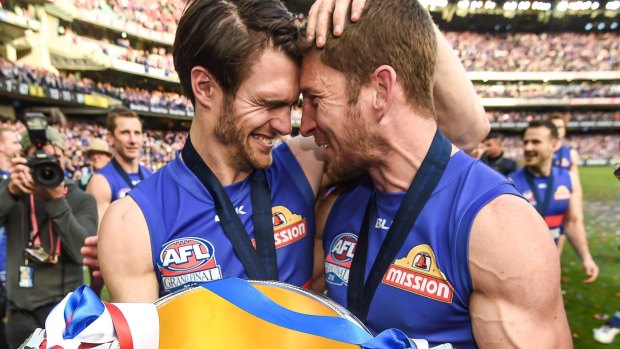 Wonderdogs: Easton Wood and Dale Morris celebrate their AFL grand final win with the cup.