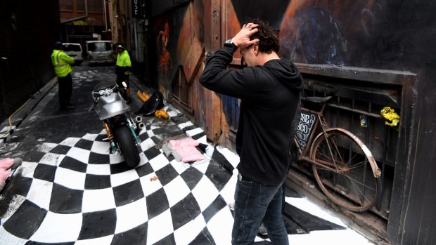 Artist Vincent fantauzzo, outraged that council has started the removal of his laneway. 