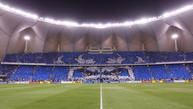 Choreography: Al-Hilal fans hold aloft placards in their team colours during a match against Qatar’s Al-Sadd in August. 

