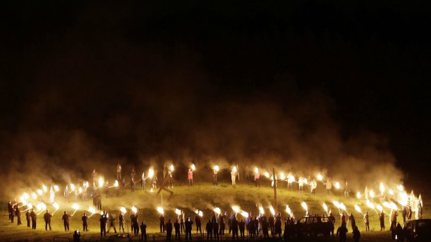 Members of the Ku Klux Klan participate in cross burnings after a "White Pride" rally in April.
