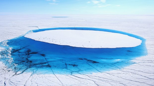 Water lies on part of the glacial ice sheet that covers about 80 per cent of Greenland.