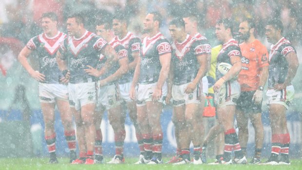Stormy weather: The Roosters get a soaking on Saturday afternoon.