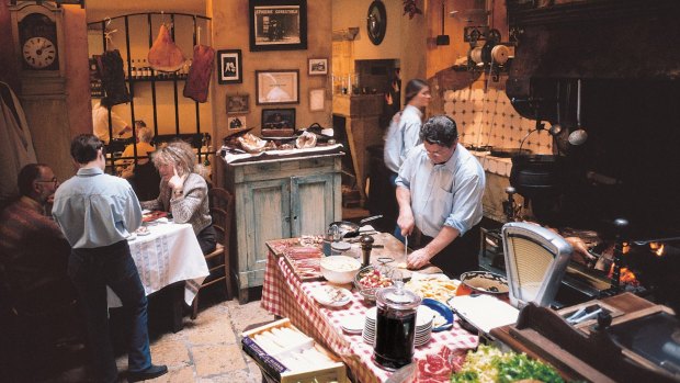 Guests and waiters in La Tupina Restaurant.