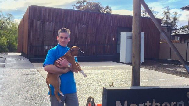 Dr Paul May in front of his new vet hospital.