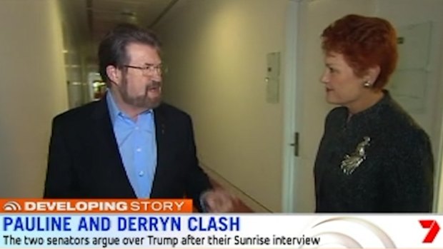 Derryn Hinch and Pauline Hanson continue their argument into the corridors on Monday.