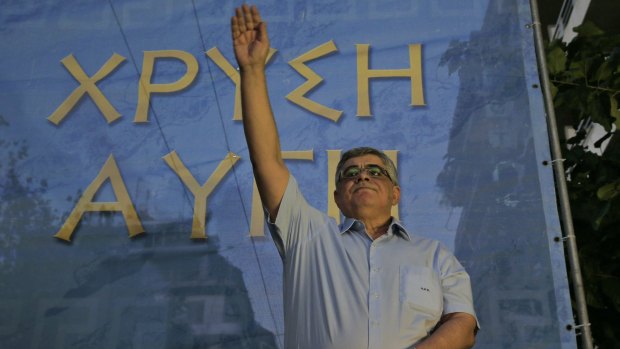 Nikos Michaloliakos, leader of Golden Dawn, salutes his supporters during a pre-election rally in Athens last week.