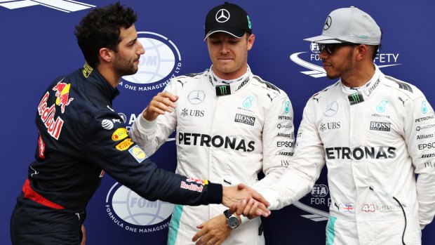 Top three qualifiers Nico Rosberg of Germany and Mercedes GP, Lewis Hamilton of Great Britain and Mercedes GP and Daniel Ricciardo of Australia and Red Bull Racing.