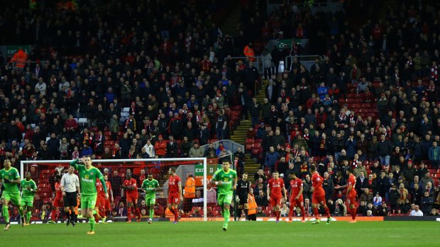 Empty seats are seen after some Liverpool supporters walked out at the 77th minute at Anfield at the weekend to protest against the ticket price hike.