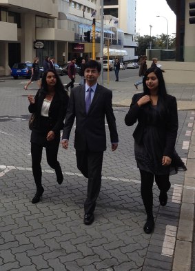Lloyd Rayney flanked by daughters Caitlyn and Sarah in Perth.
