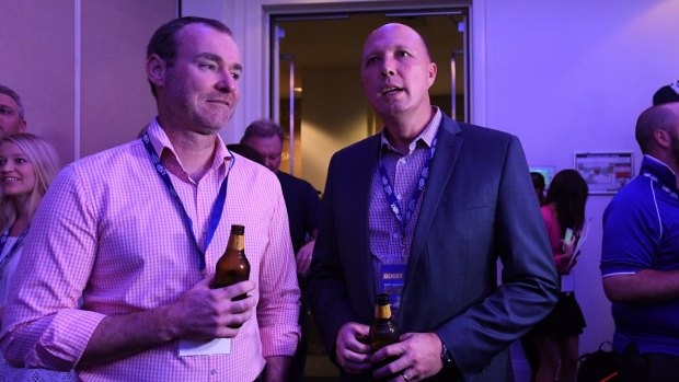 Immigration Minister Peter Dutton is seen at the LNP Election party.